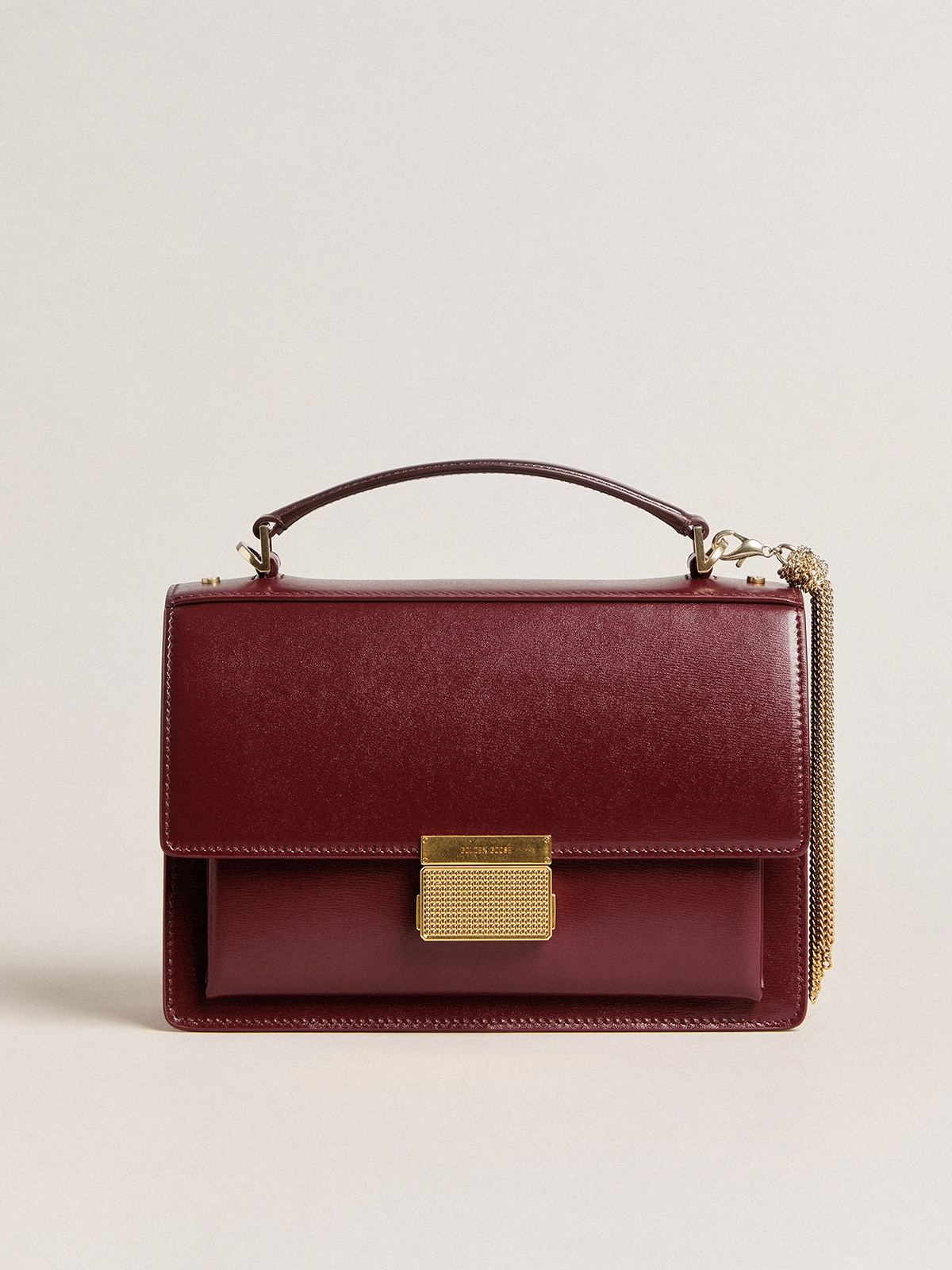 Venezia Bag in burgundy boarded leather with gold details | Golden Goose